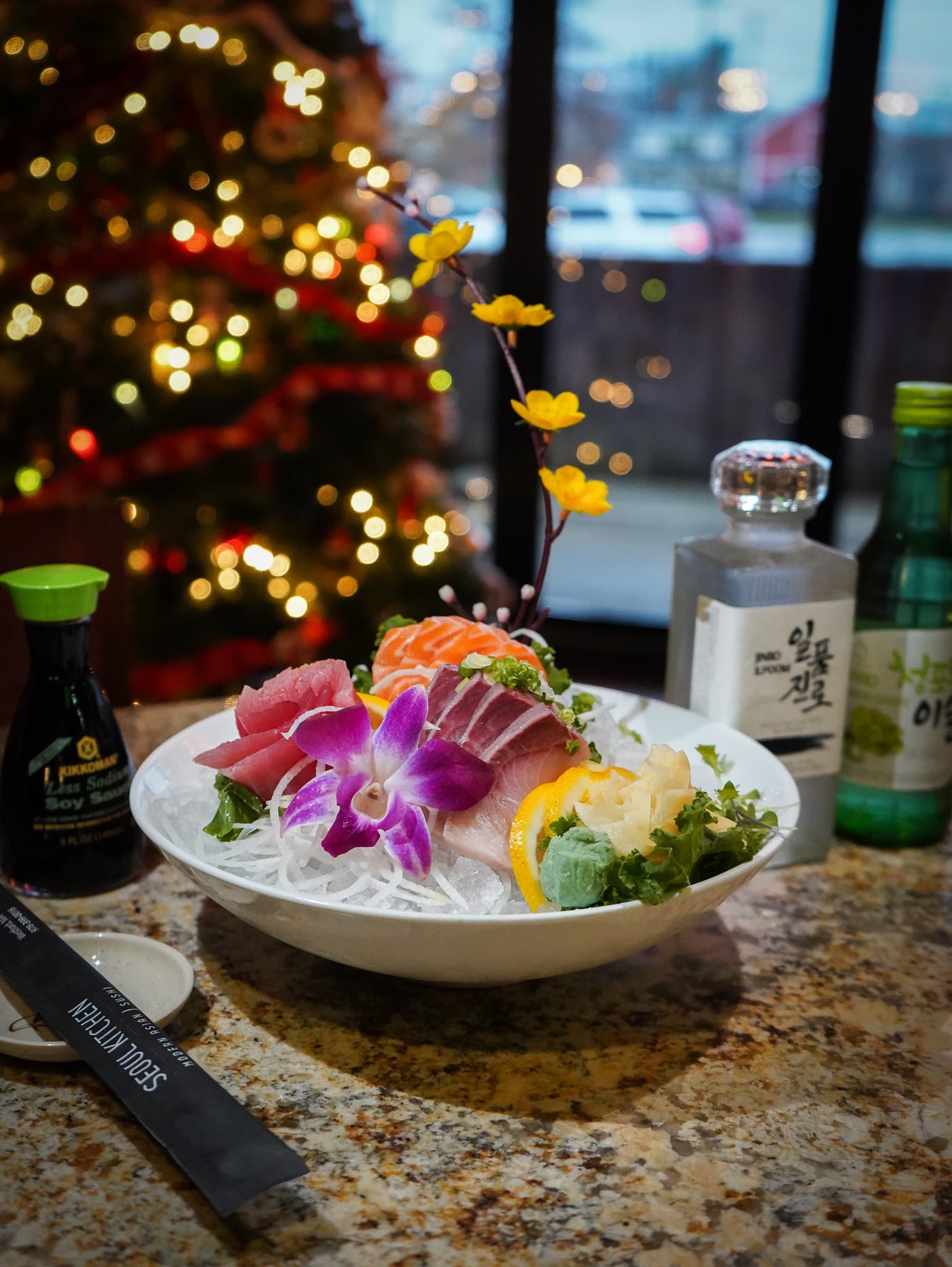 Sashimi bowl with an orchid, served with soju